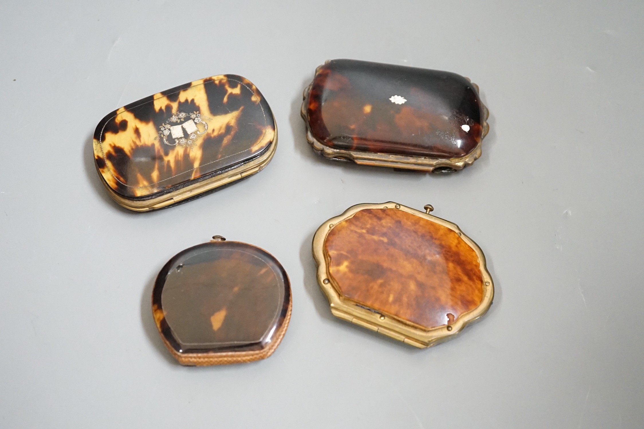 Four 19th century tortoiseshell and piqué work purses